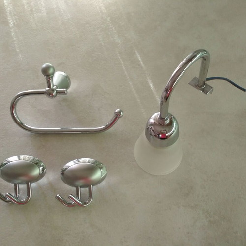 Bathroom accessory set like new with light, paper holder, and double hooks