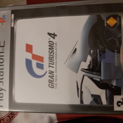 Sony PlayStation 2 console used with remote and 10 games