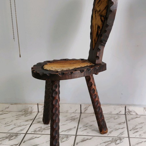 Spanish rustic chair used with three legs and animal leather from the 1960s