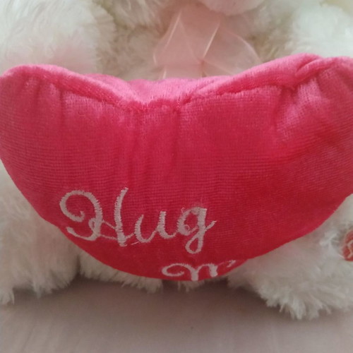 Plush bear used that changes colors and plays music