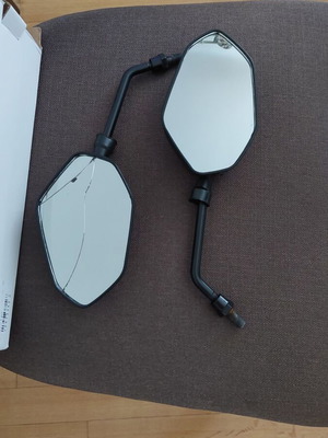 Motorcycle mirrors used, one with cracks