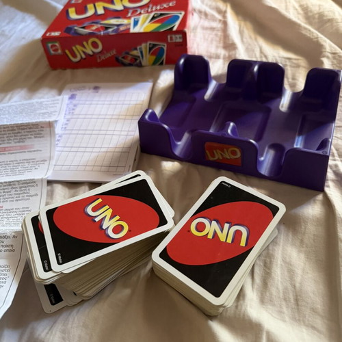 Uno Deluxe card game used with base and score notebook