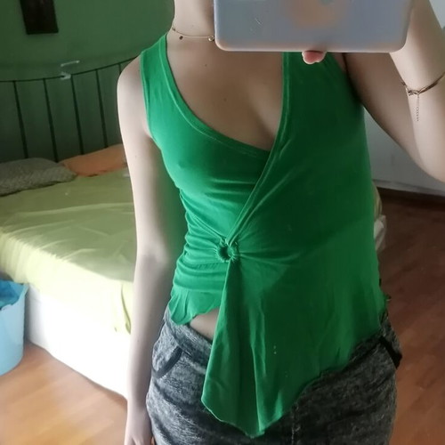 Green blouse with ring detail, size Small