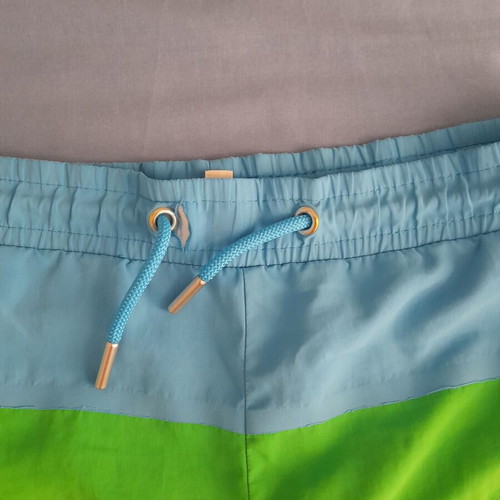 Lacoste swim shorts used, multicolor, size 128 cm