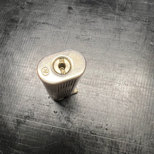 Silver lighter used, unknown if working