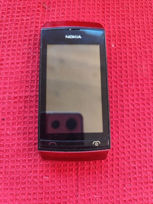 Nokia Asha 306 used, red, no charger, small corner crack