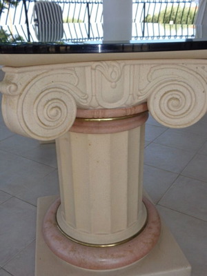 Table with marble columns and crystal surface like new