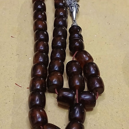 Amber worry beads used with silver elements and tassel