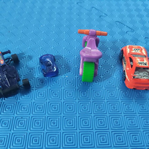 Set of 4 small toys like new, toy cars and motorcycle