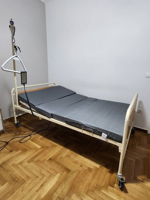 Hospital bed with adjustable backrest and remote control, like new, with mattress