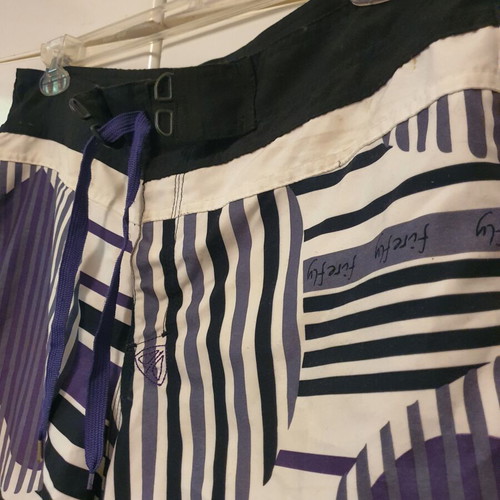 Firefly swim shorts with patterns size L like new, black and purple