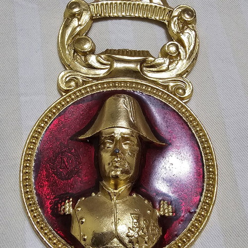 Collectible metal bottle opener with Napoleon bust and red enamel