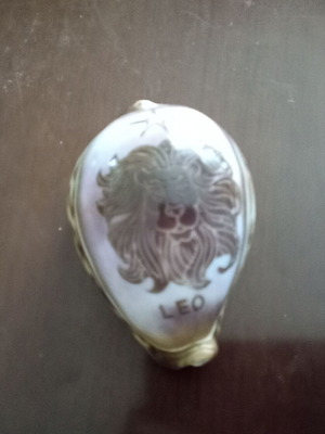 Handmade painting on shell with Leo zodiac sign like new