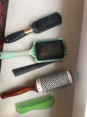 Collection of used combs and brushes