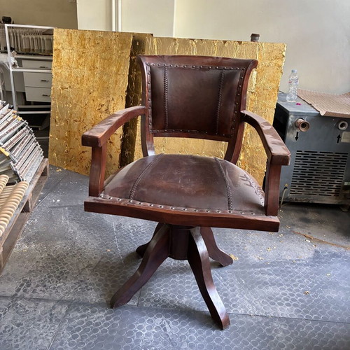 Wooden swivel office chair with leather upholstery