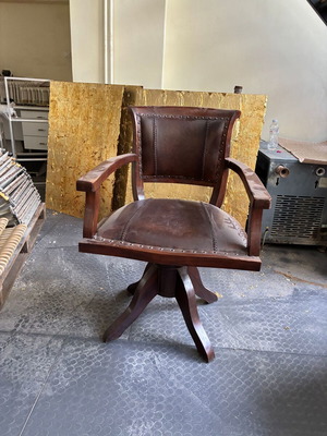 Wooden swivel office chair with leather upholstery