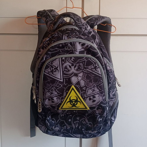 Polo character school backpack with multiple compartments
