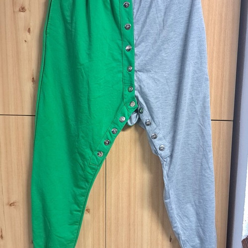 Two-tone sweatpants used, gray and green with metallic buttons, size XL