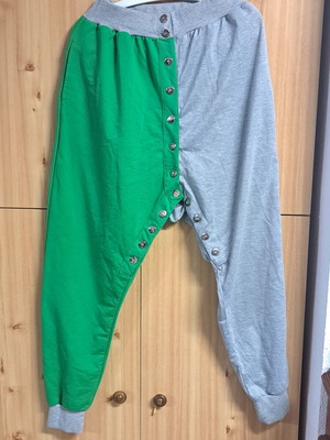 Two-tone sweatpants used, gray and green with metallic buttons, size XL