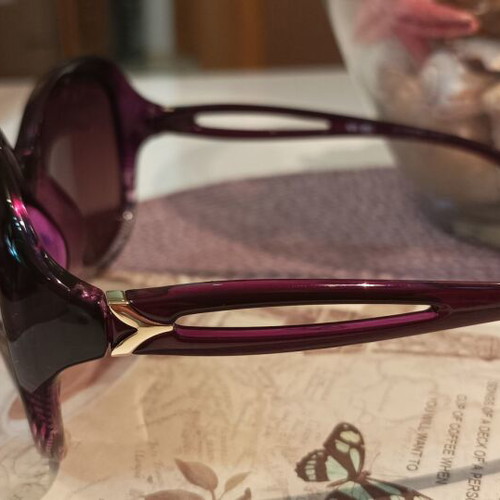 Women's oversized purple sunglasses with gold details