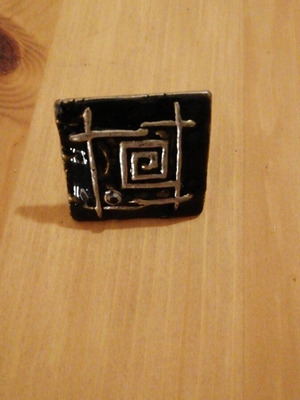 Square statement ring used with black enamel and silver geometric design