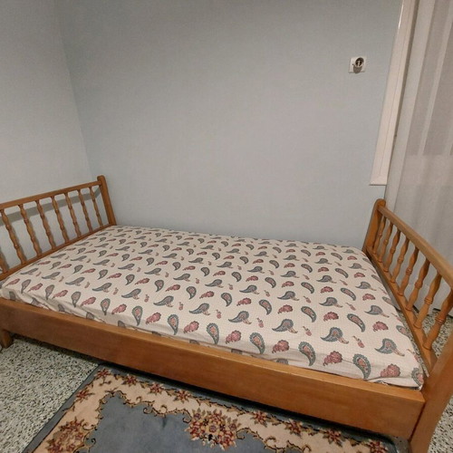 Single solid wood bed used with new mattress