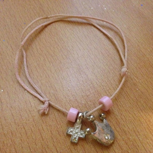 Pink bracelet with beads, cross and crown, used
