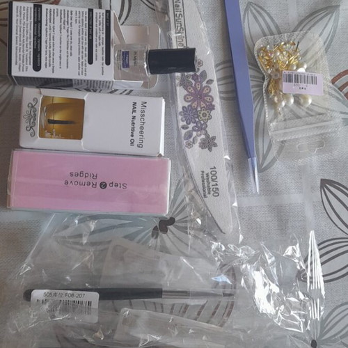 Manicure accessories new set with brushes, tweezers, files, oil, and stickers