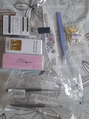 Manicure accessories new set with brushes, tweezers, files, oil, and stickers