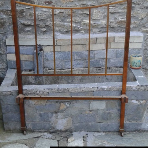 Iron bed used, early 20th century with brass details