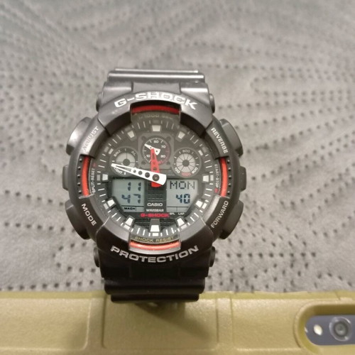 Casio Gshock GA100 watch used, black and red