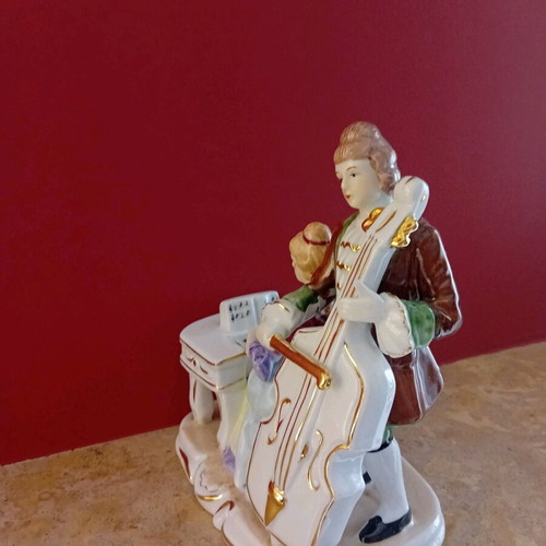 Porcelain vintage figurine with couple playing musical instruments new
