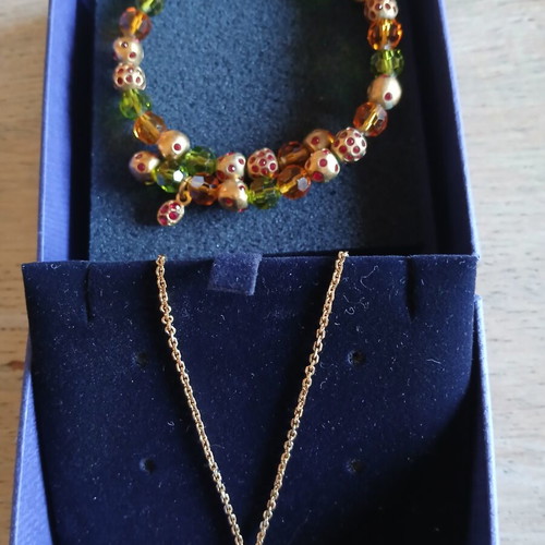 Swarovski necklace and bracelet set like new, gold color