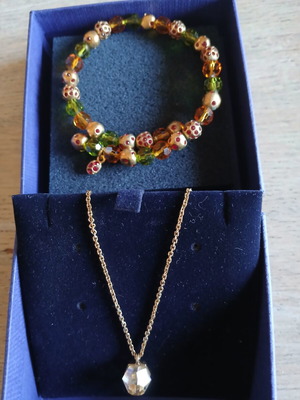 Swarovski necklace and bracelet set like new, gold color