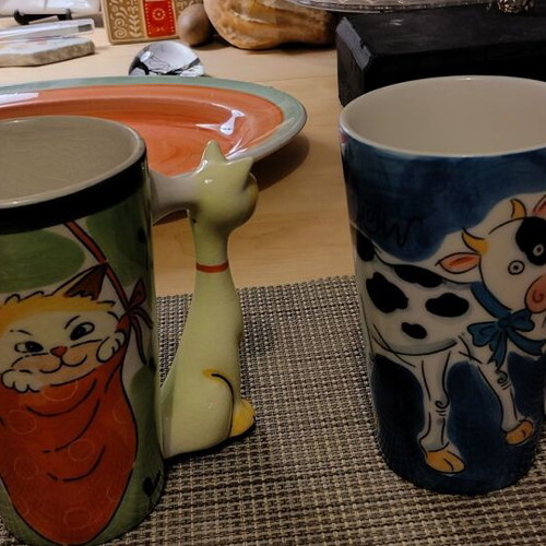 Large mugs used with cat and cow handles