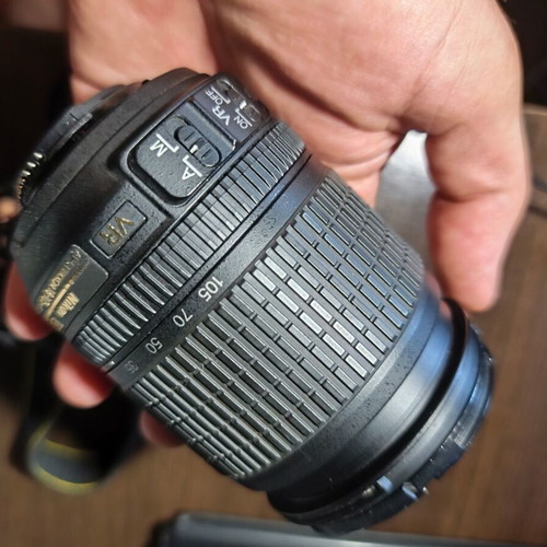 Nikon D5200 DSLR with Nikkor 35mm f/1.8G lens and accessories