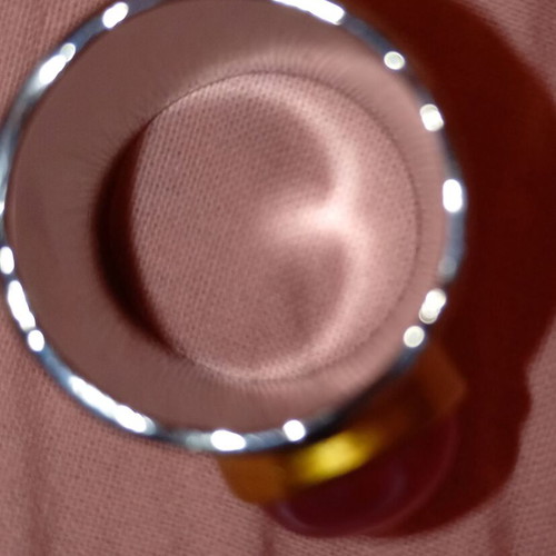 Enigma ring with pink oval stone and hammered copper metal