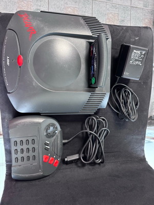 Atari Jaguar 64Bit console used with game and joystick adapter