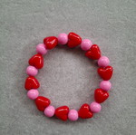 Handmade bracelet with red and pink heart beads new
