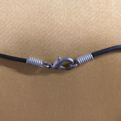 Short necklace used with hand holding arrow pendant in white metal