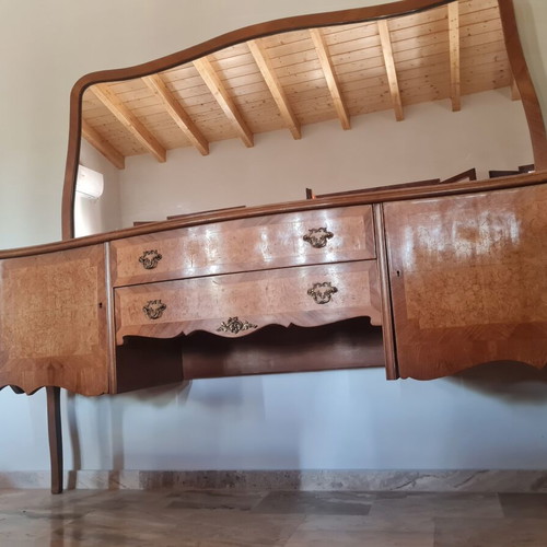 Classic wooden buffet with large curved mirror