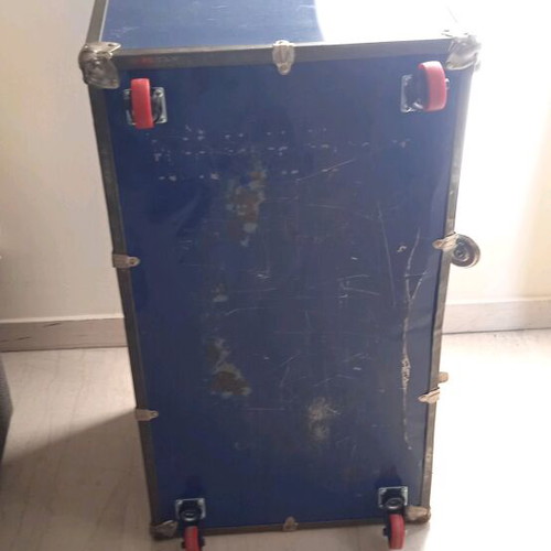 Vintage trunk table refurbished with leather handle and wheels