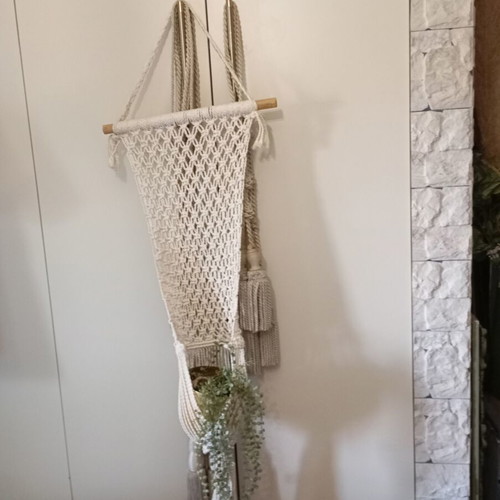 Two knitted wall hangers for pots, different sizes