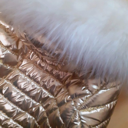 Short gold jacket with white fur and hood