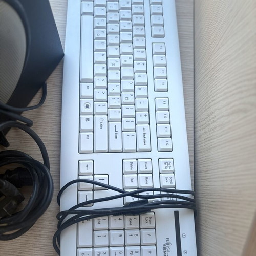 Fujitsu-Siemens computer monitor and Logitech speakers with keyboard and webcam