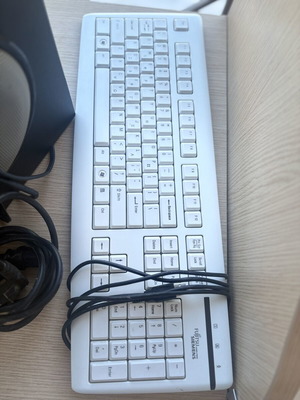 Fujitsu-Siemens computer monitor and Logitech speakers with keyboard and webcam