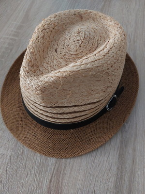 Straw hat like new with black strap, one size