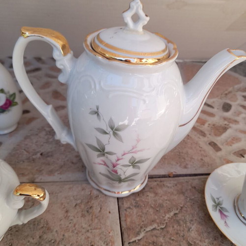 Porcelain tea set collectible with gold details and small vases like new