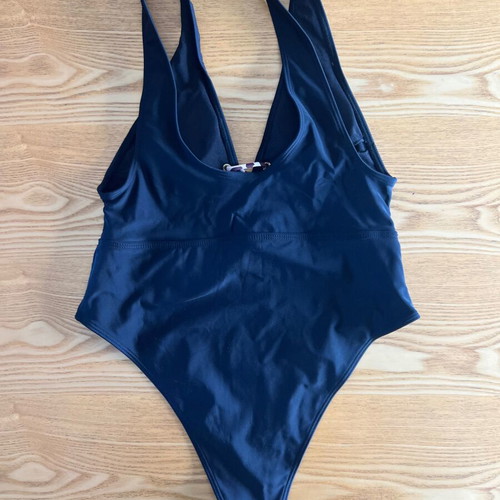 Black one-piece swimsuit with animal print cord, size L, like new