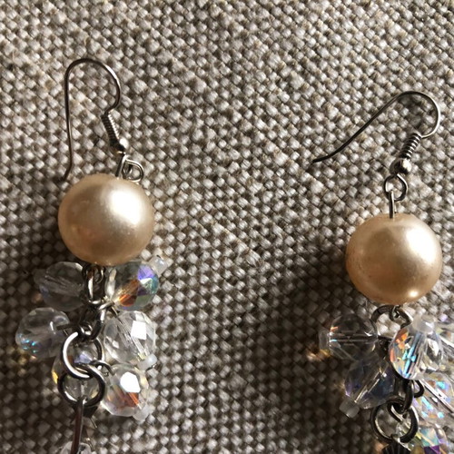 Evening earrings used with beige pearl and crystals